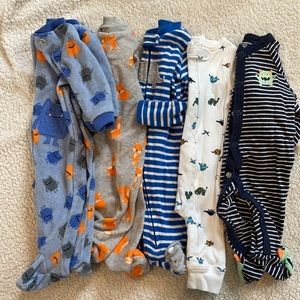 Five pairs of Carter’s new born pajamas